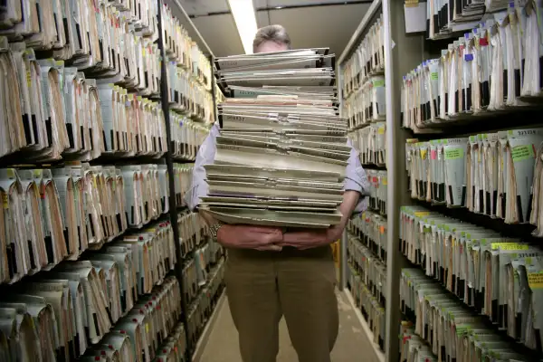 GERMANY, Feature bureaucracy, Our picture shows a man carrying a big mountain of files.