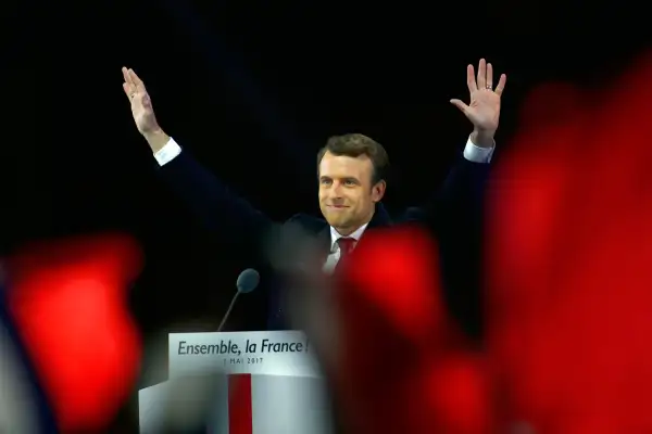 Emmanuel Macron and his wife Brigitte Macron salute voters after his speech as he celebrates his Presidential election victory At Le Louvre In Paris on May 7, 2017 in Paris, France. Emmanuel Macron won the French Presidential election over extreme right candidate Marine Le Pen.