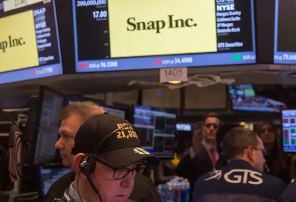 Traders work on the floor during the Snap Inc. IPO at the New York Stock Exchange, March 2, 2017, in New York.