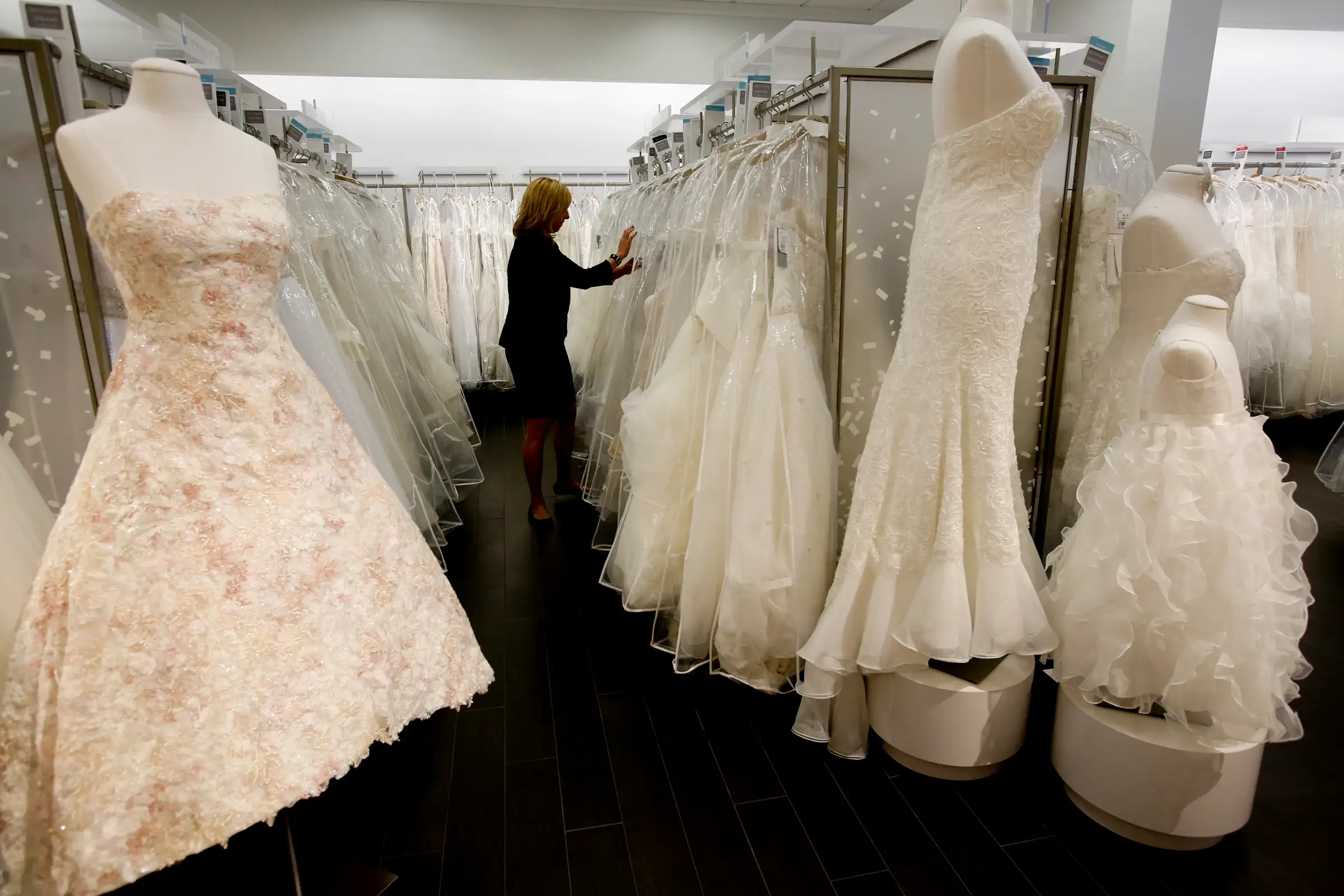 LOS ANGELES, CA. - JANUARY 20, 2014: Store manager Sonni Sanders (CQ) looks for gowns for customers