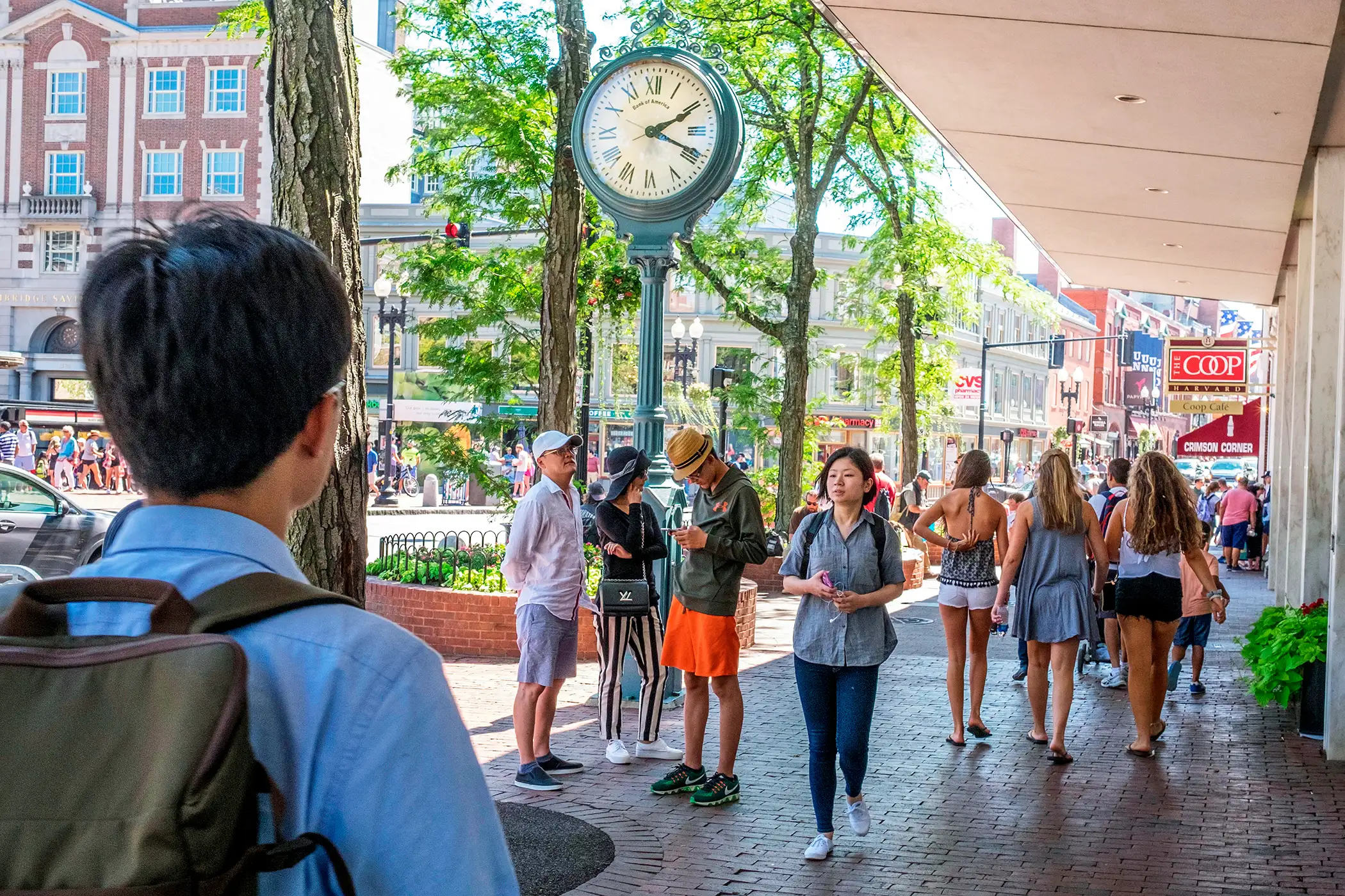 Students walk through Harvard Square, Cambridge, Massachusetts.