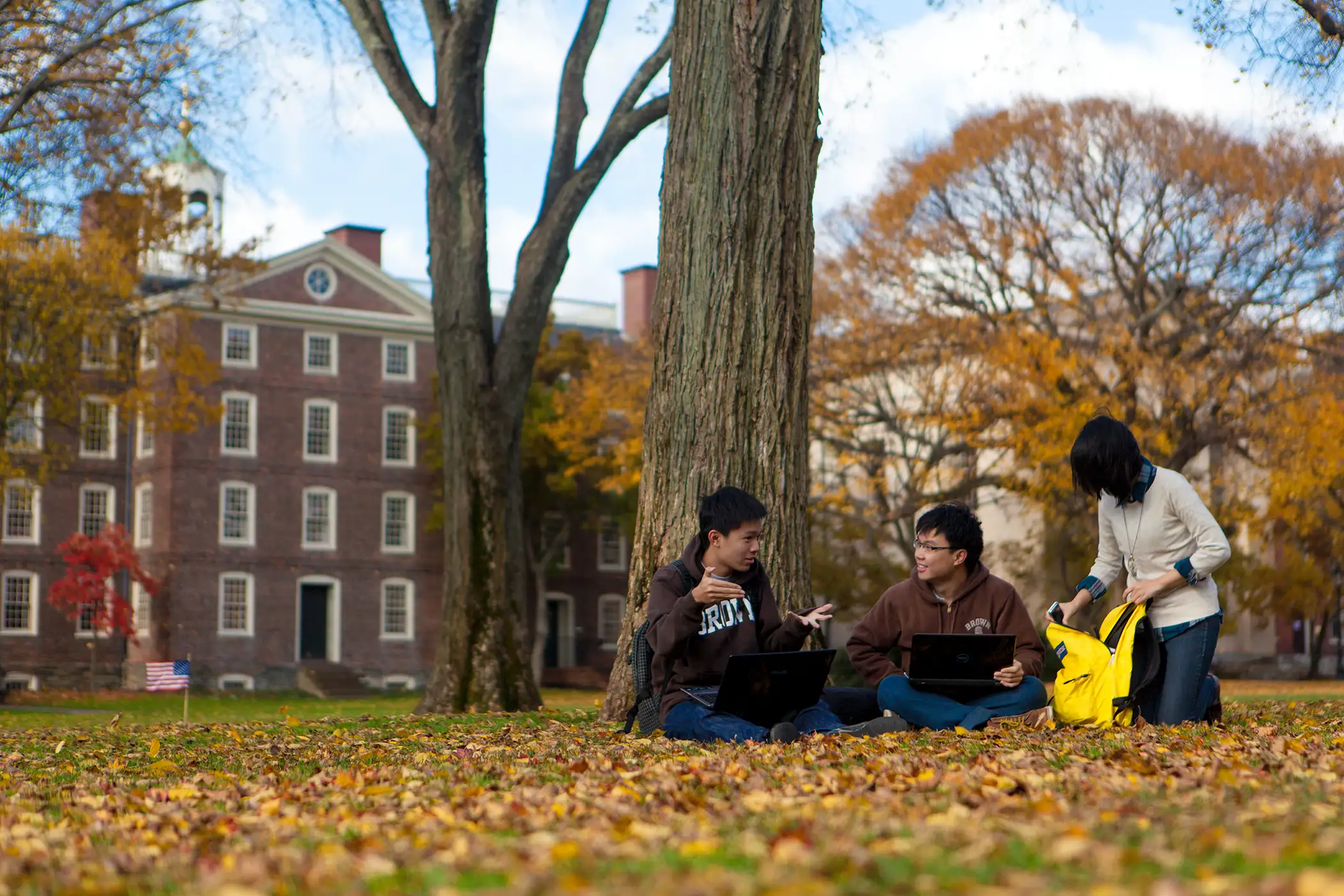 Students on the Quiet Green in autumn