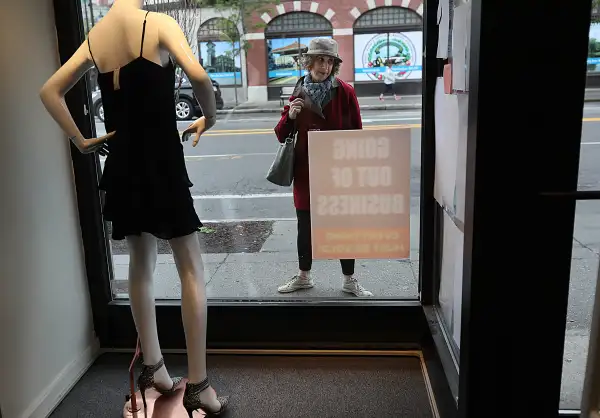Customers see the business closing signs outside of the Second Time Around consignment shop in Brookline, MA on Jun. 5, 2017. The consignment shops Second Time Around are closing and many customers have not been paid.