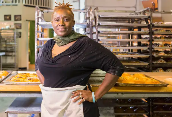 baker standing in bakery kitchen