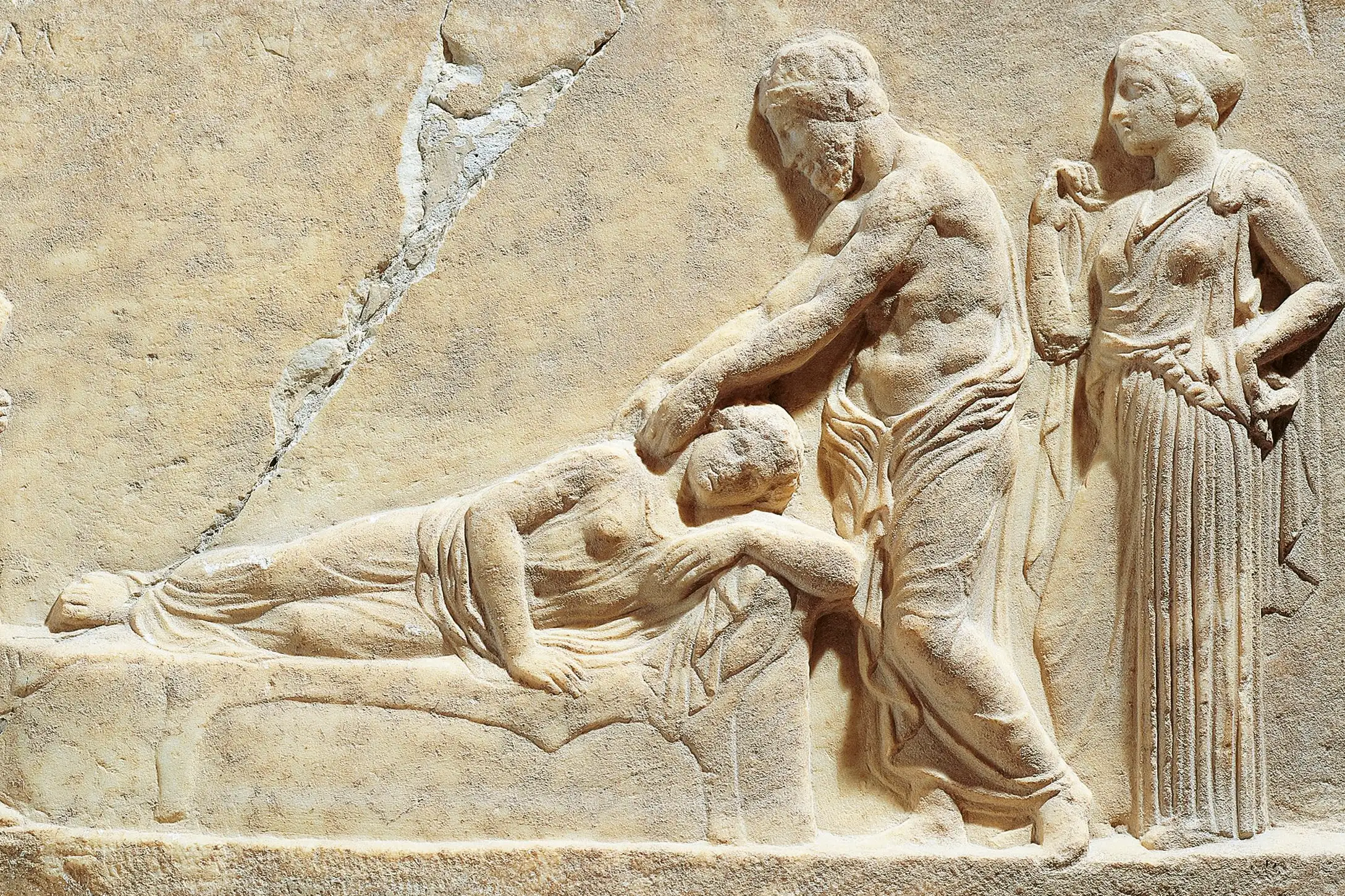 Marble relief depicting Asclepius or Hippocrates treating ill woman, from Greece, Il Pireo, Archaeological Museum, 5th Century B.C.