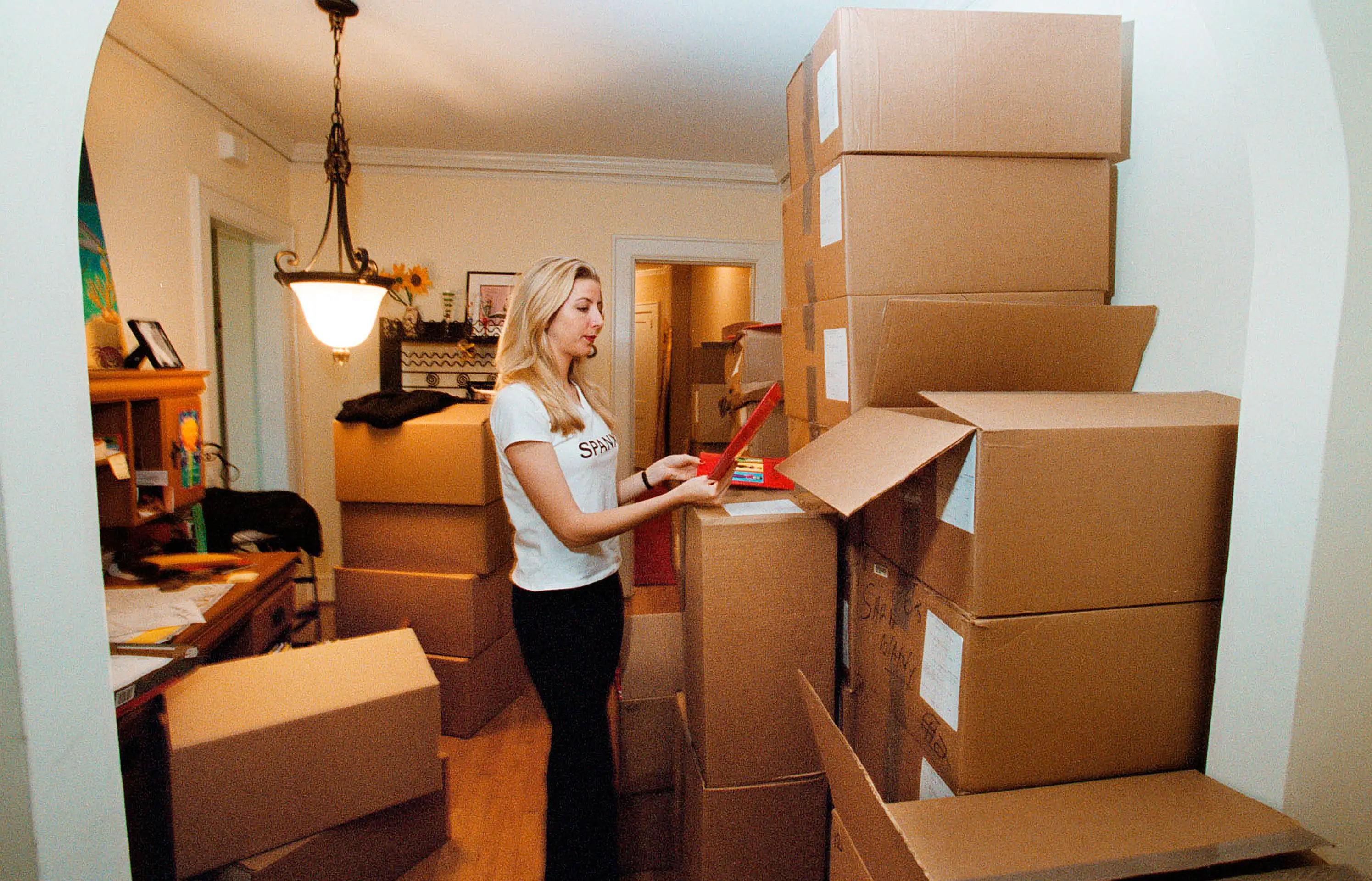 Blakely unpacking Spanx boxes in 2000 in her Clearwater, Fla. apartment.