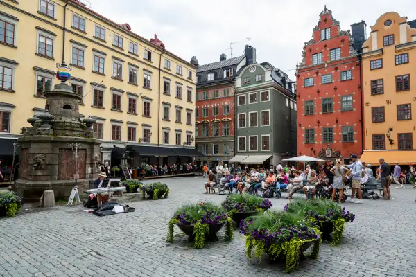 People sitting at Stortorget Square in Gamla Stan, Stockholm, Sweden, Scandinavia, Europe