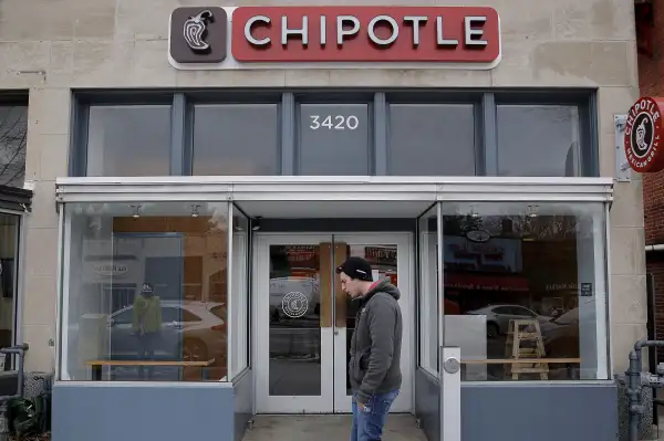 A man walks by a Chipotle Mexican Grill in Washington, February 8, 2016.