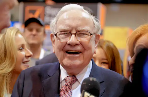 Berkshire Hathaway Chairman and CEO Warren Buffett laughs while touring the exhibit floor at the CenturyLink Center in Omaha, Neb., Saturday, May 6, 2017, where company subsidiaries display their products.