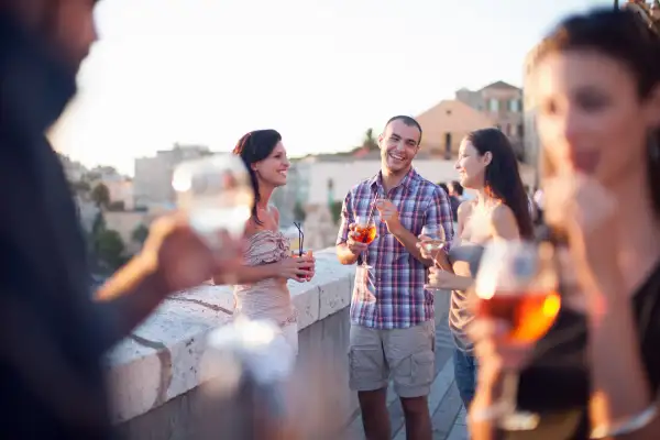 Friends having drinks on balcony