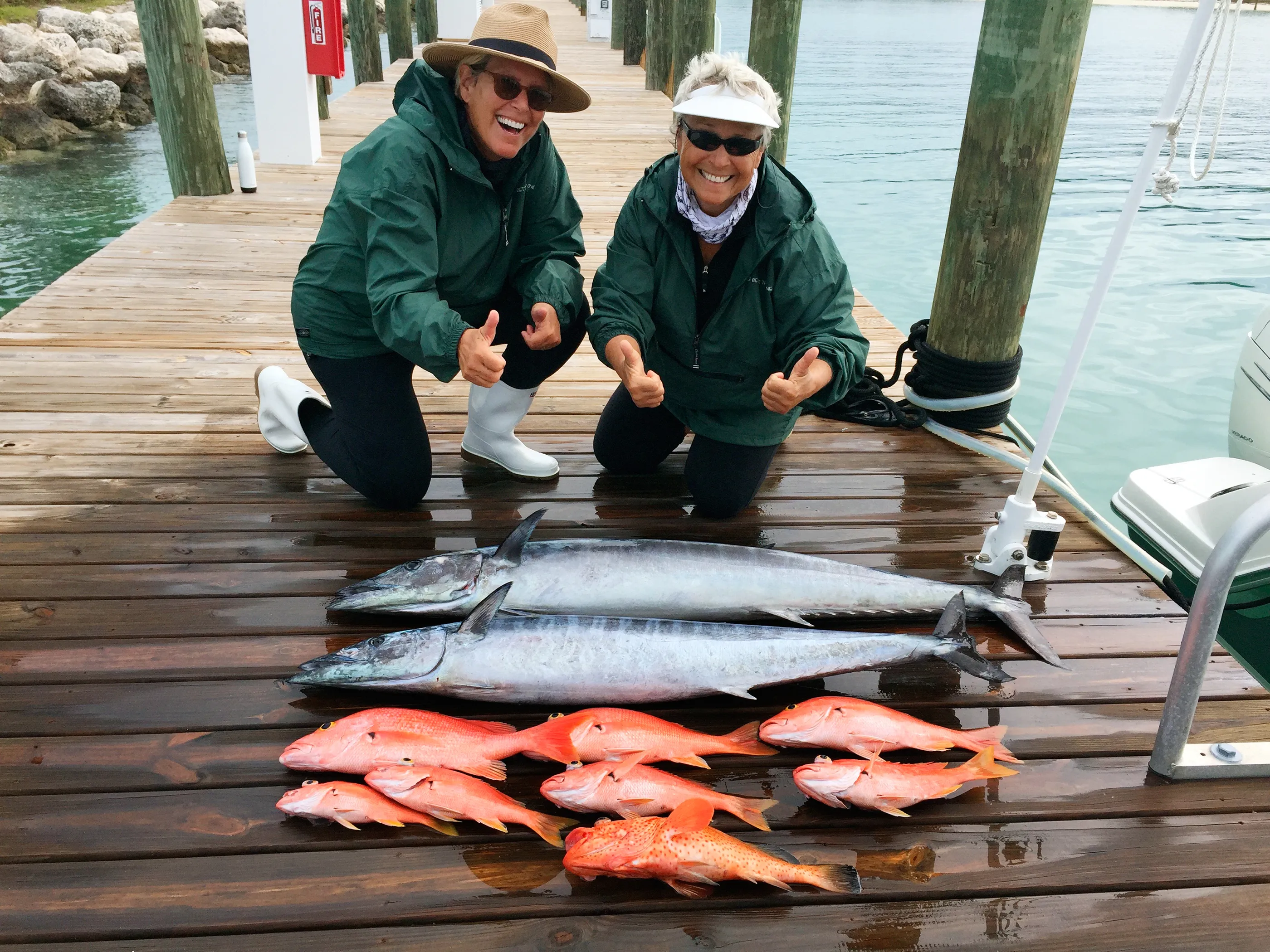 Orman (left) and Travis keep a list of fish species they're aiming to hook, crossing each one off as they make the catch.