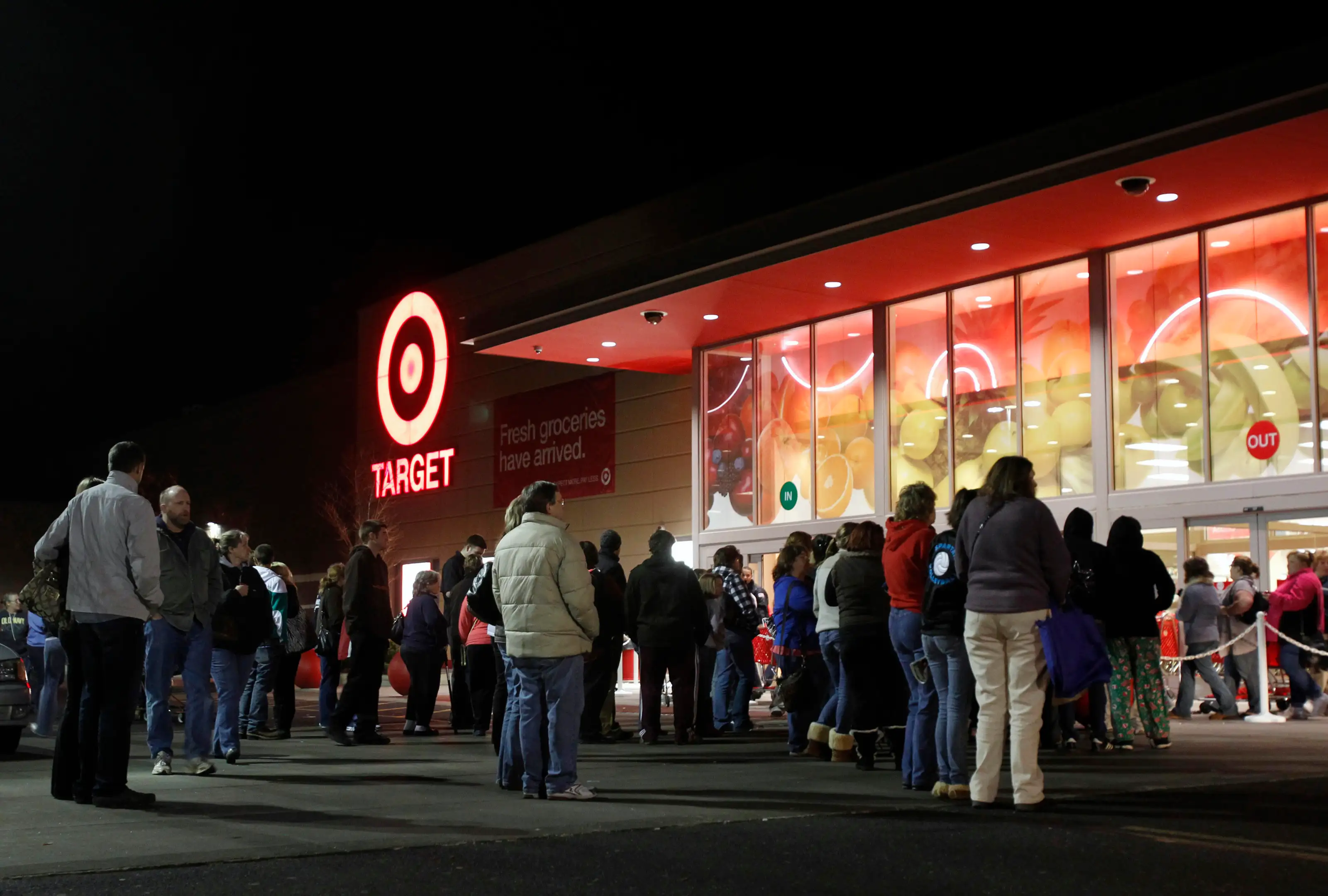 Shoppers stand outside of a Target store at midnight on &quot;Black Friday&quot; as they wait for those who stood in line to enter the store first in Torrington