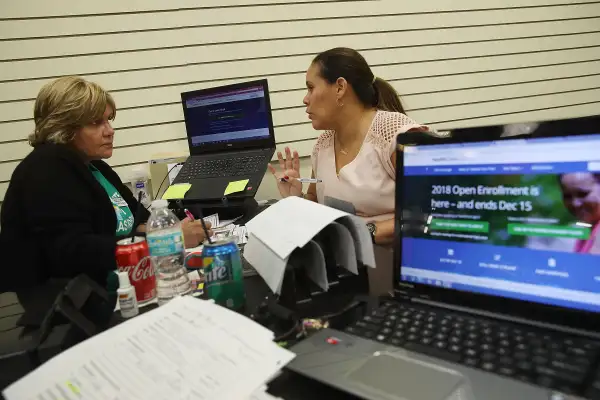 People Sign Up For Health Care Coverage Under The Affordable Care Act During First Day Of Open Enrollment