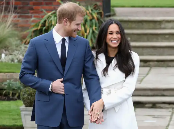 Prince Harry and Meghan Markle during an official photocall to announce the engagement of Prince Harry and actress Meghan Markle at The Sunken Gardens at Kensington Palace on November 27, 2017 in London, England.