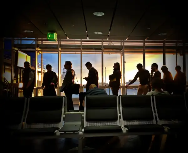 Travelers In Line At Airport