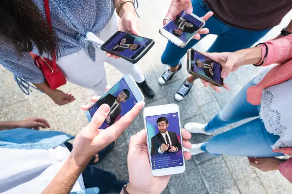 A group of friends playing HQ Trivia