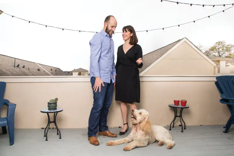 Money-Makeover-Hicks Warren and Lauren Hicks with their golden doodle, Ravi, on the terrace of their Houston condo.
