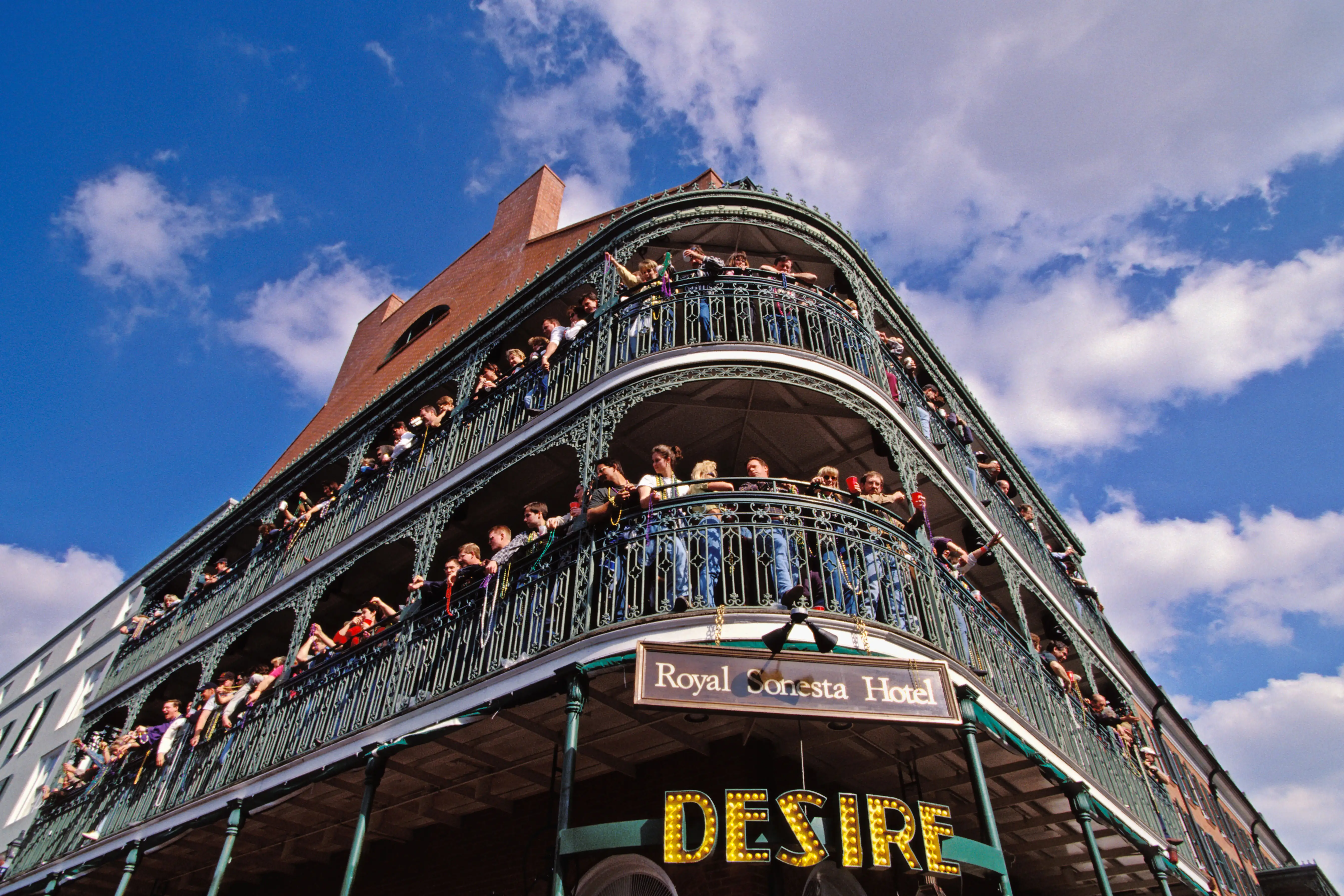 New Orleans Louisiana Mardi Gras Crowds Line Balconies Of Royal Sonesta Hotel In French Quarter