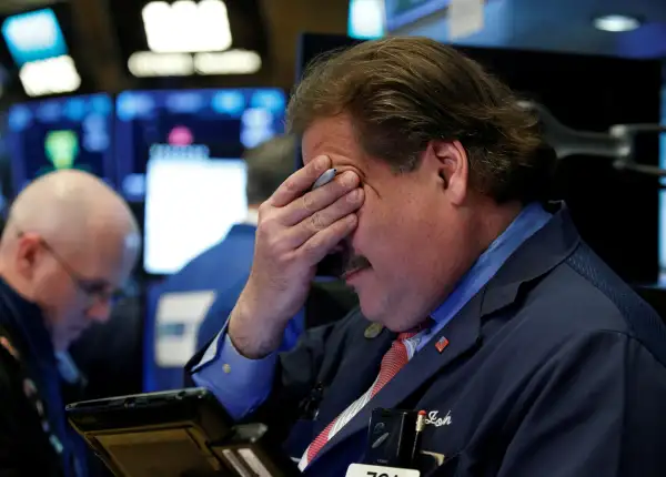 Traders work on the floor of the New York Stock Exchange