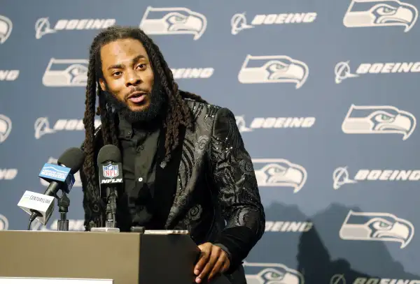 Seattle Seahawks cornerback Richard Sherman talks to reporters during a post-game press conference following an NFL football game against the Houston Texans, in Seattle, October 29, 2017.