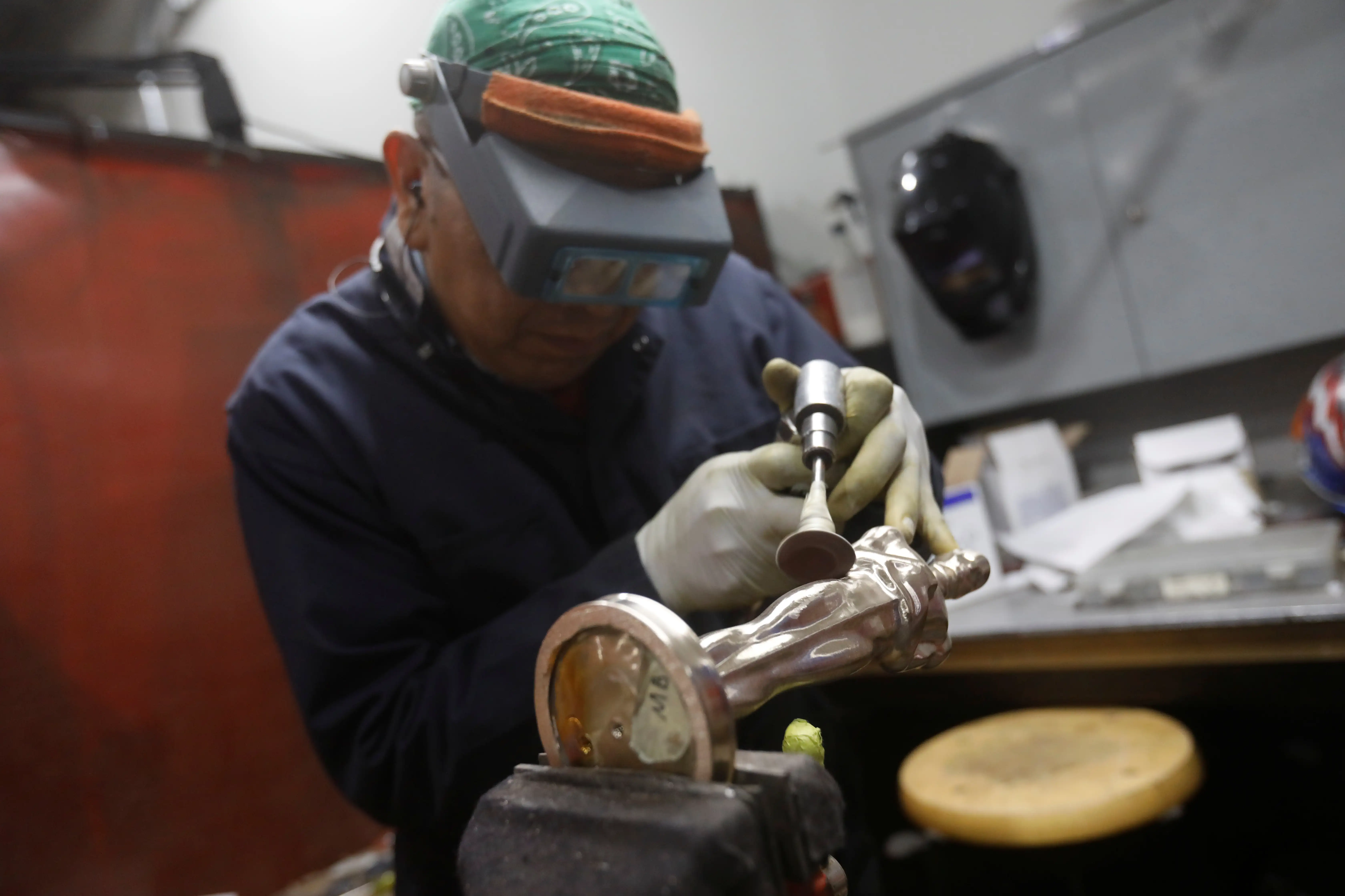 An Oscar statuettes are polished at the Polich Tallix foundry in Walden, New York