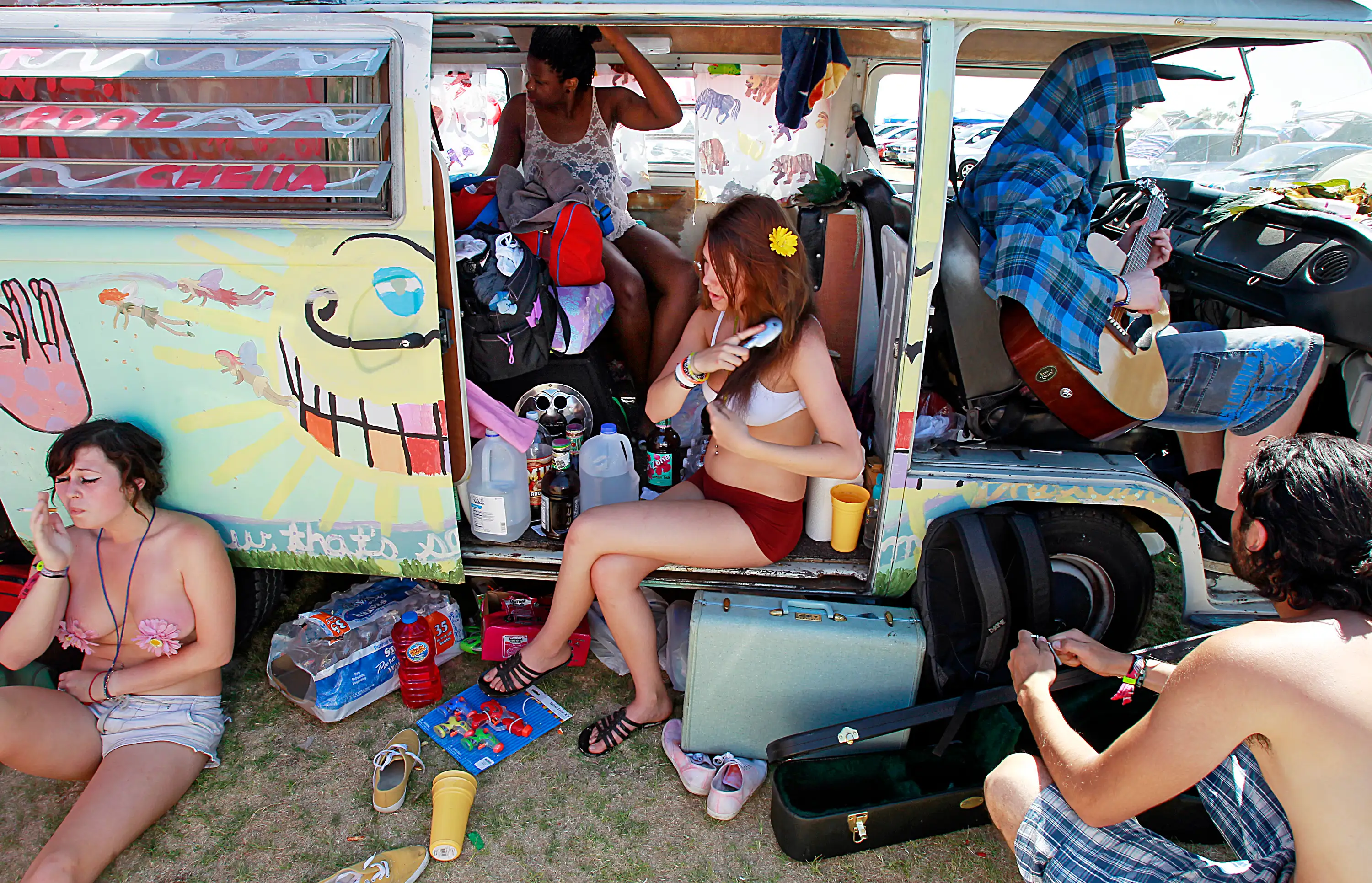 A group of festivalgoers chill out at an onsite campground Sunday, April 17, 2011, at the Coachella