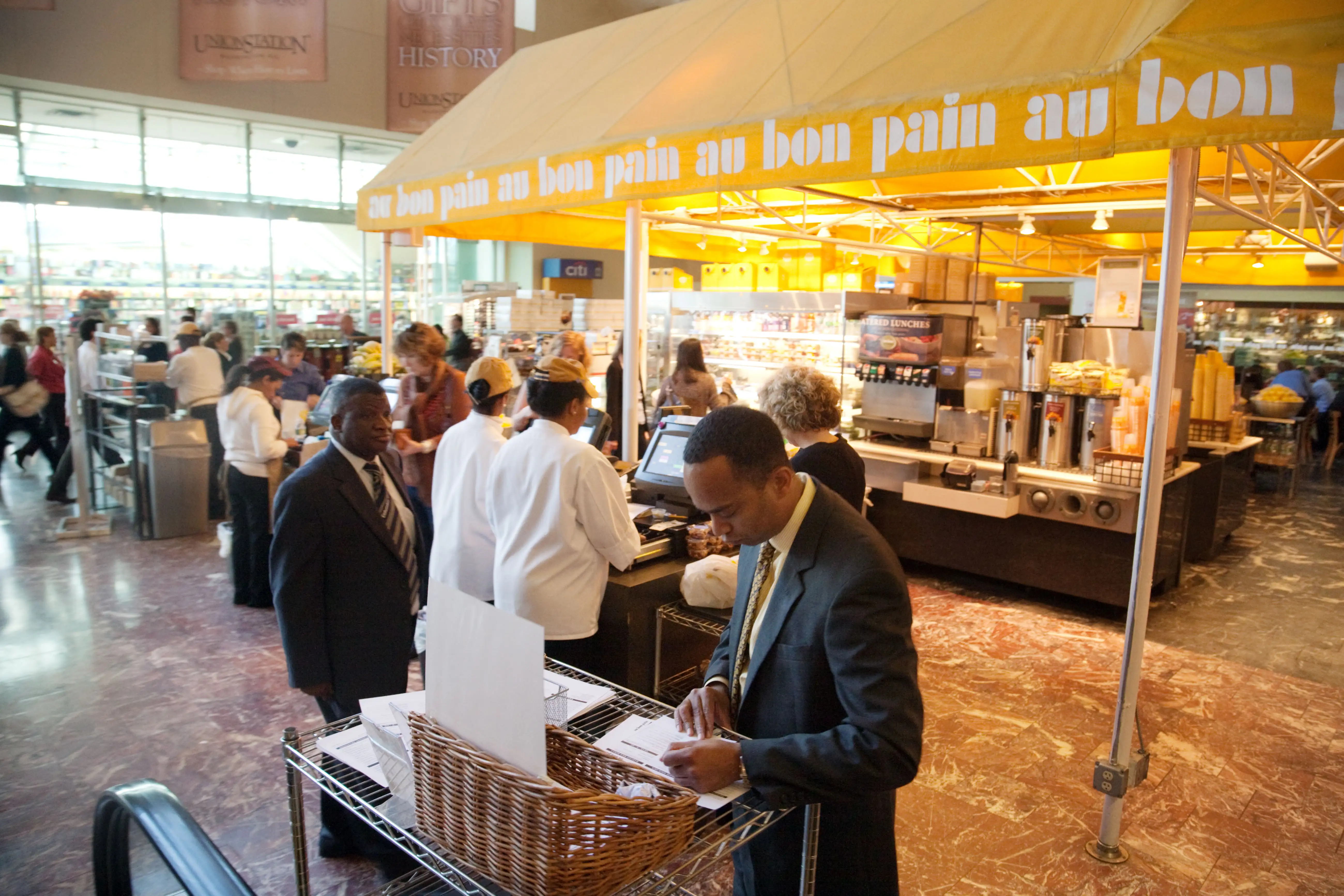 People buying food at Au Bon Pain restaurant / cafe , Union Station, Washington DC USA