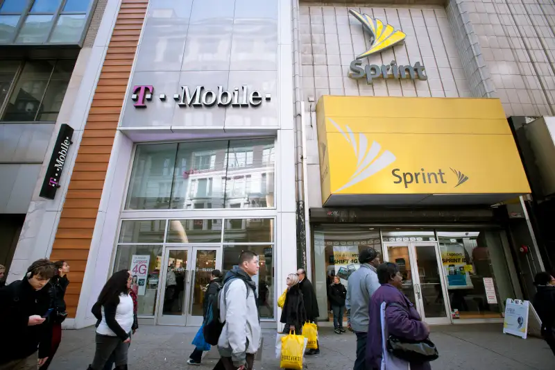 T-Mobile Sprint Merger T-Mobile and Sprint Nextel cellular phone stores adjoin each other in Herald Square in New York on Tuesday, March 8, 2011.