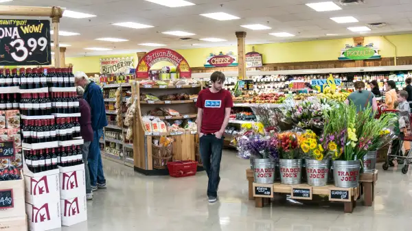 bright colorful spacious interior of Trader Joes market with displays  wine fruit artisan bread buckets fresh flowers Lynnwood