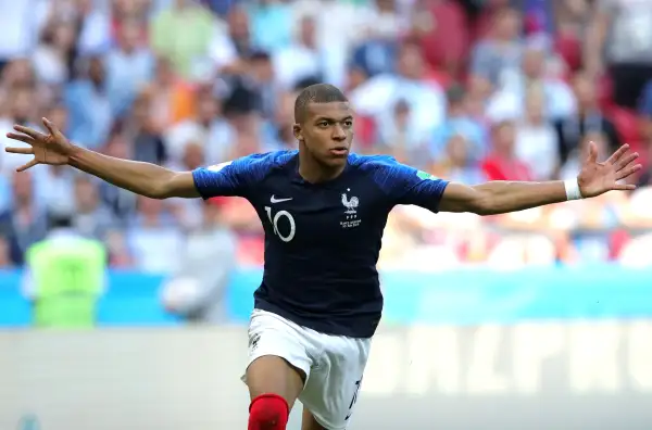 Kylian Mbappe runs with his arms spread open during the France v Argentina match during the 2018 FIFA World Cup Russia
