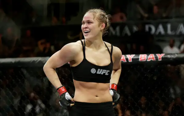 Ronda Rousey with her hands on her hips in boxing ring