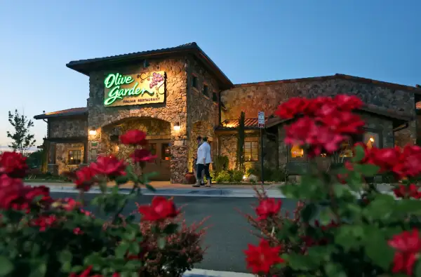 Patrons enter an Olive Garden Restaurant in Short Pump, Va.