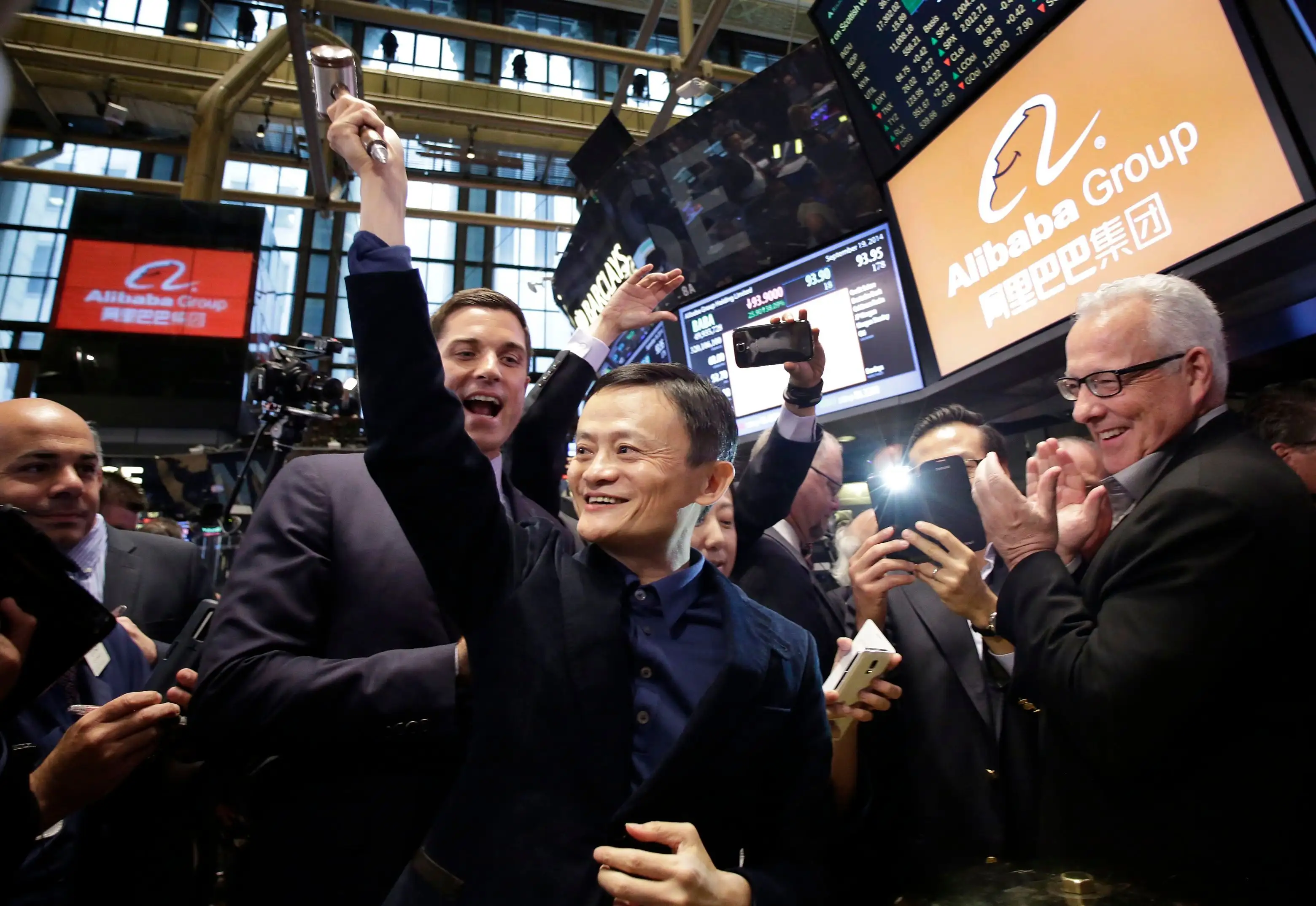 Jack Ma Alibaba founder Jack Ma, center, raises a ceremonial mallet before striking a bell during the company's IPO at the New York Stock Exchange, in New York.