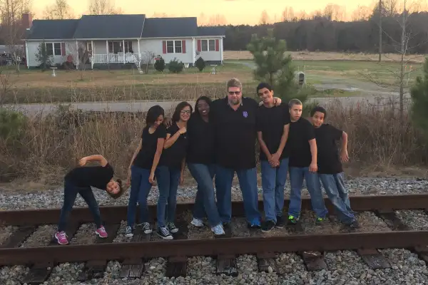 The eight members of the Malone family. Next fall, Sabrina and Daniel Sr. will be paying college bills for the four oldest kids.