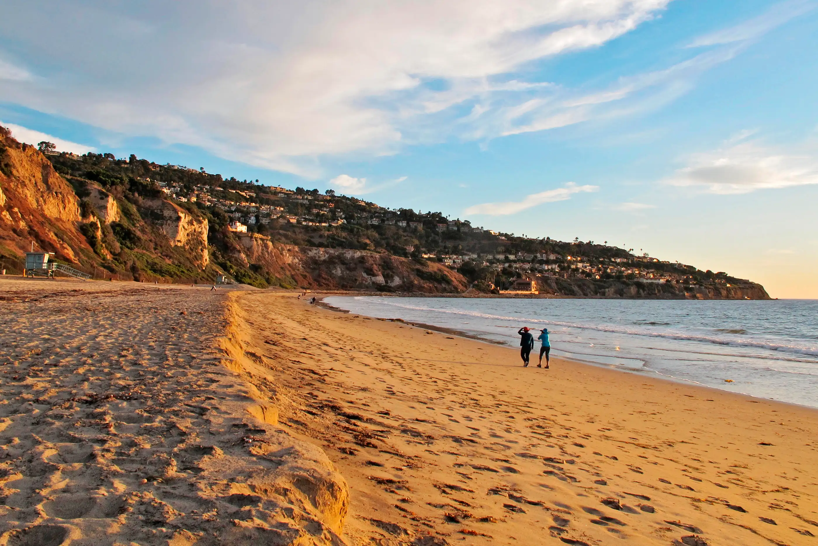 Pair Walking along the shore at Torrance Beach, Los Angeles, California