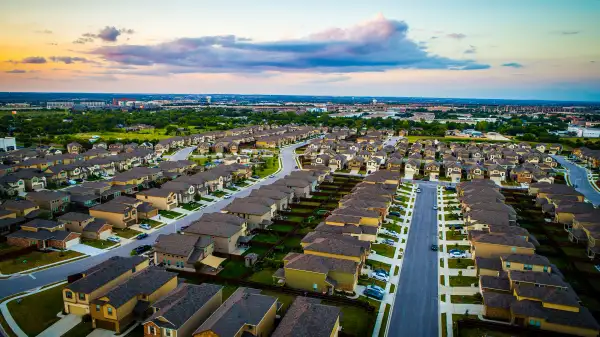 Sunset above modern suburb new homes in Austin