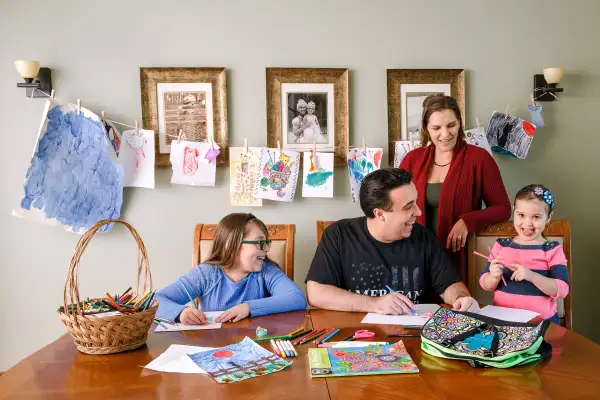 Michael Essany with wife Crista and their daughters Gianna (left) and Isabella at home in Valparaiso, Ind.