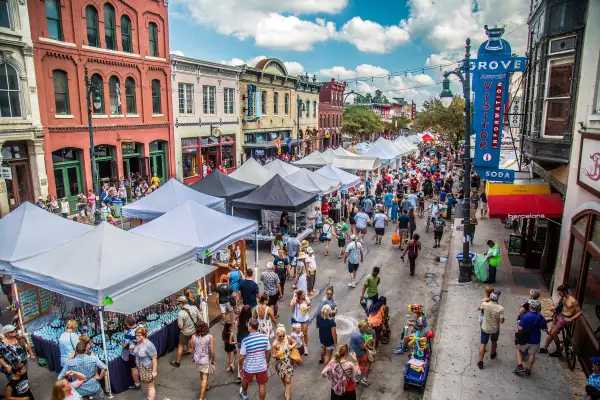 Visitors enjoy Austin's annual Pecan Street Festival, featuring arts, crafts, and music.