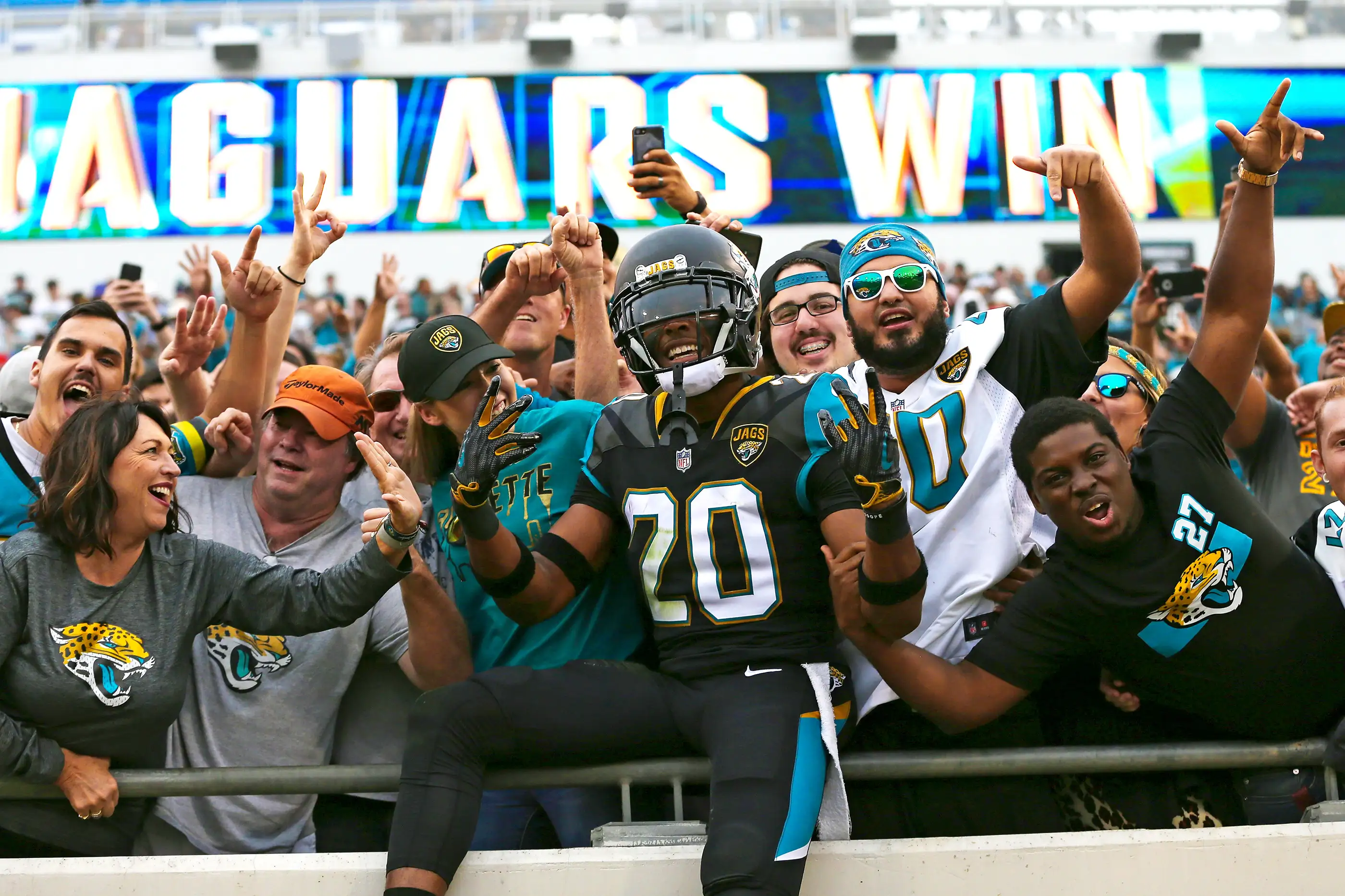 Jalen Ramsey of the Jacksonville Jaguars celebrates after a big win with fans.