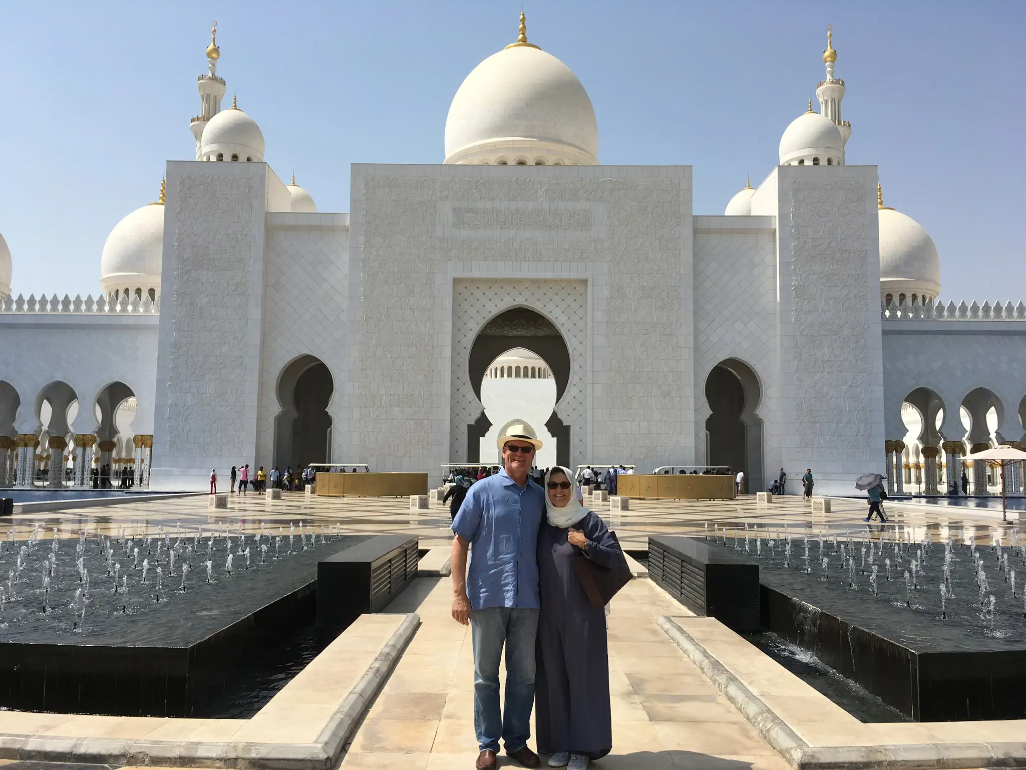 Dona Dower and her husband in front of The Grand Mosque in Abu Dhabi