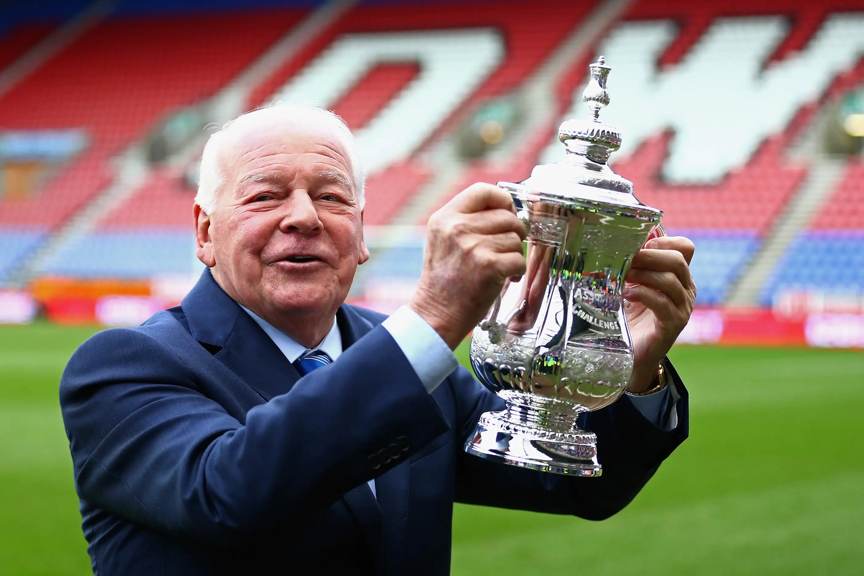 Wigan Athletic Chairman Dave Whelan holds the FA Cup prior to the Budweiser FA Cup fourth round match between Wigan Athletic and Crystal Palace at DW Stadium on January 25, 2014 in Wigan, England.
