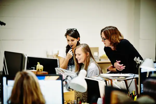 Female architects reviewing project on computer