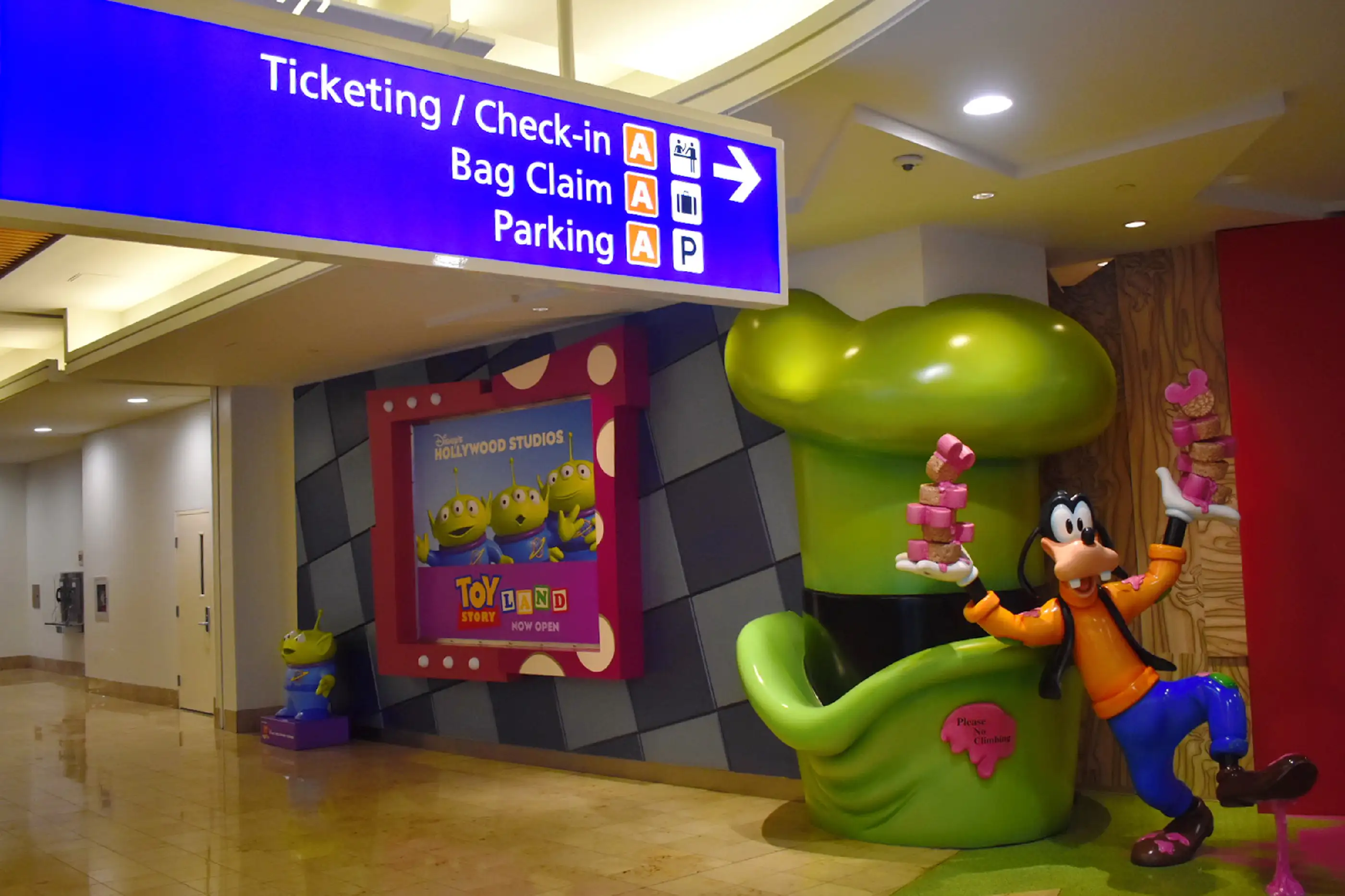 Orlando, Florida; August 28, 2018: Ticketing and Check in information sign at the airport and Goofy.