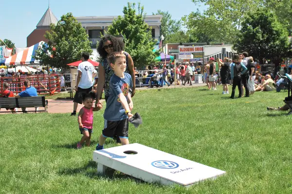 child playing cornhole in Dranesville, Virginia