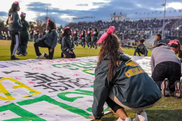 cheer team setting up poster in germantown, maryland