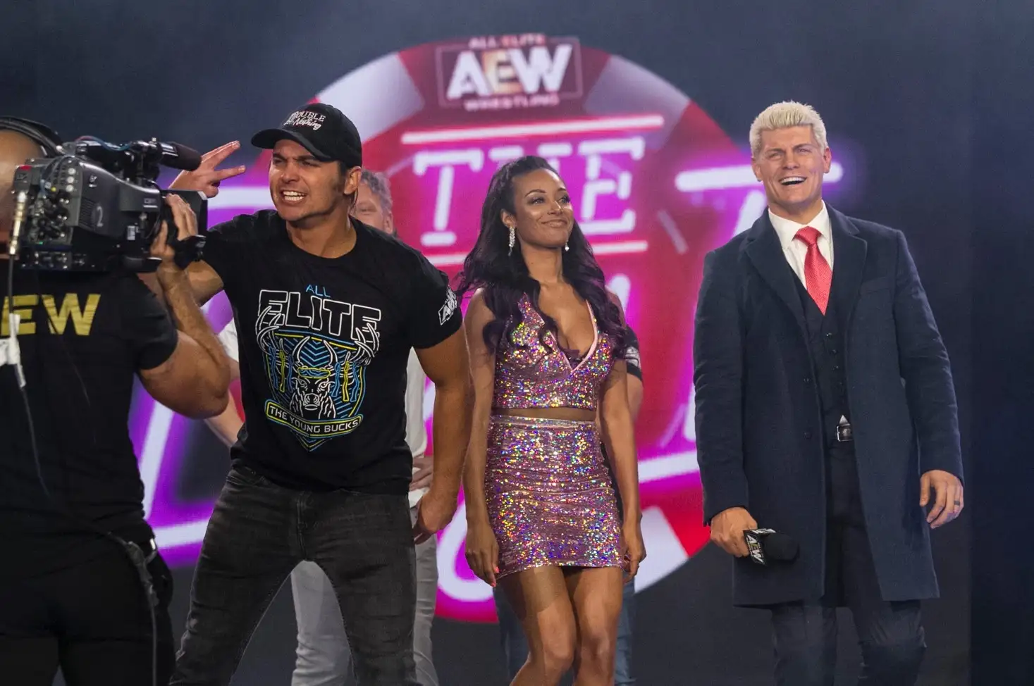 Nick Jackson, Brandi Rhodes (center), and Cody Rhodes at an All Elite Wrestling event.