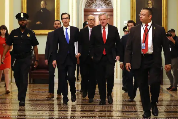 WASHINGTON, DC - MARCH 24:  Treasury Secretary Steven Mnuchin (2L), White House Director of Legislative Affairs Eric Ueland (3L) and White House Chief of Staff Mark Meadows (4L) arrive at the U.S. Capitol.