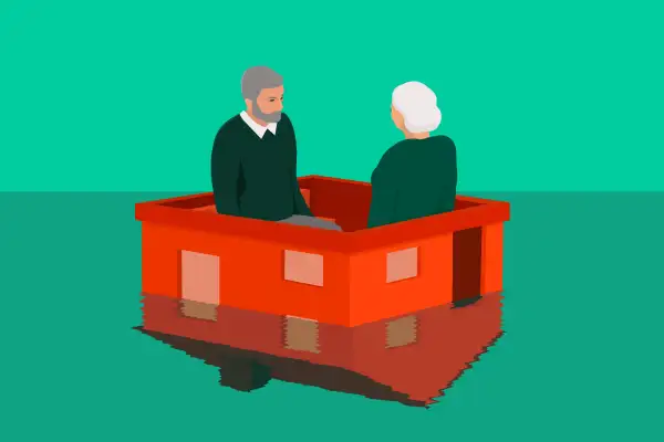 two older adults sitting on a house that is going underwater what is a reverse mortgage