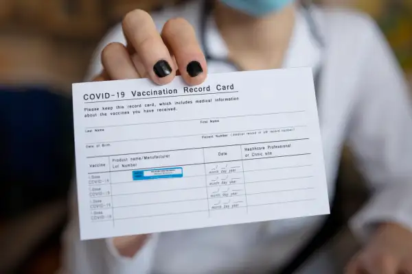 Please Stop Posting Your COVID Vaccination Cards