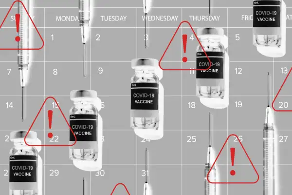 Multiple vials of Covid-19 vaccine and syringes on a calendar background